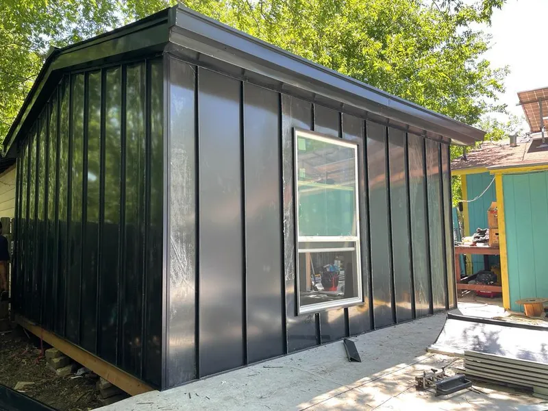 Black standing seam metal wall panels for Roof Inspection in Buckley